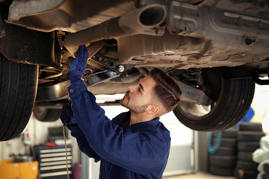service technician working on a car - Riverhead GMC in Riverhead NY